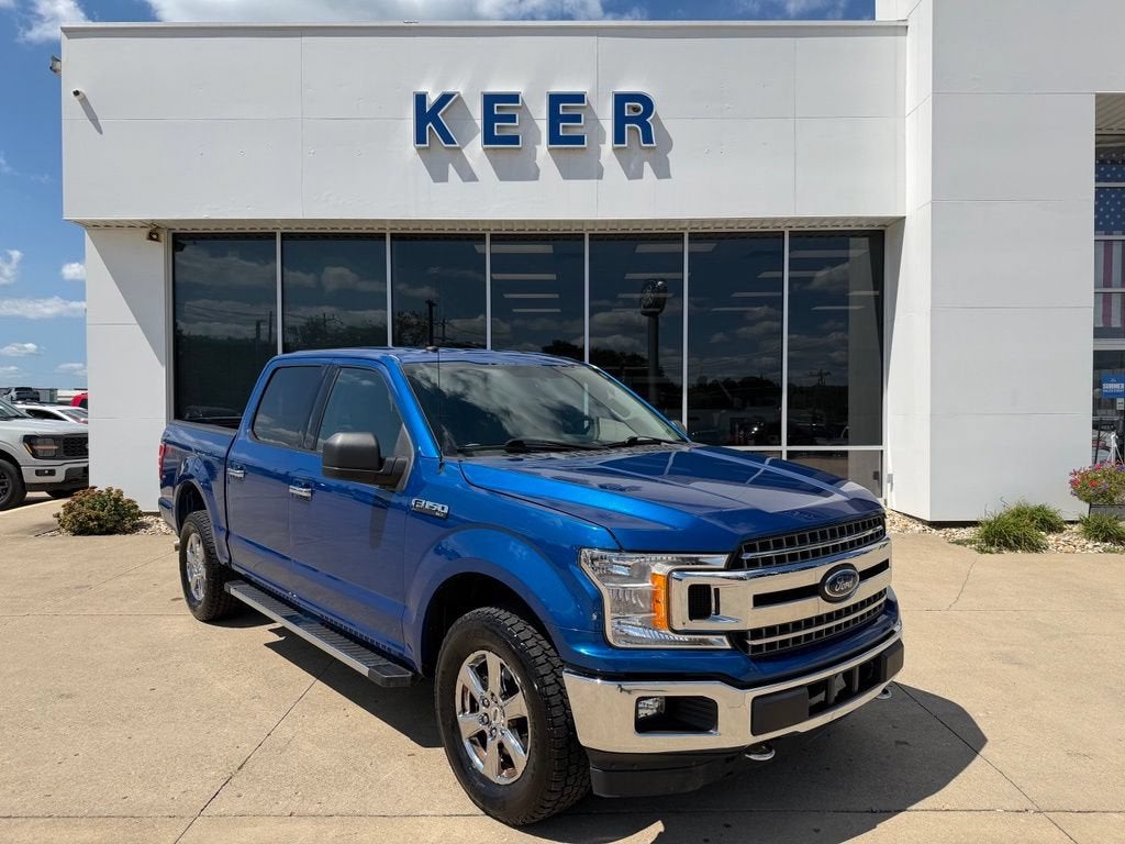 2018 Ford F-150 XLT in Lightning Blue — front three-quarter view